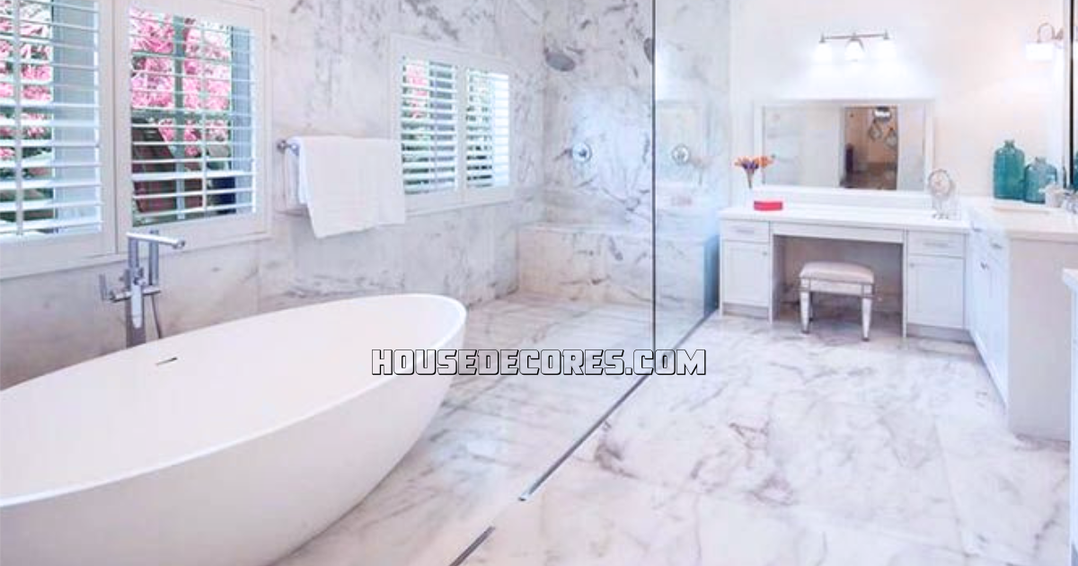 A luxurious bathroom with marble flooring, white fixtures, and a unique feature of a soaking tub inside the shower.