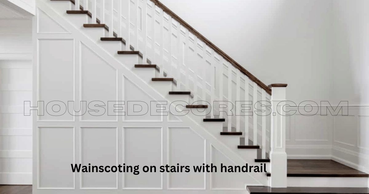Wainscoting on white stairs with brown handrail