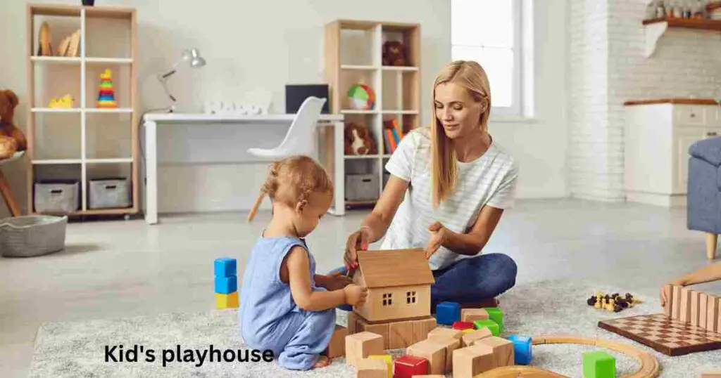 A kid is playing with mom in kids playhouse.
