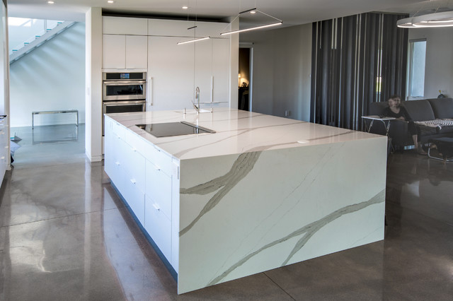 Contemporary kitchen with waterfall edge island